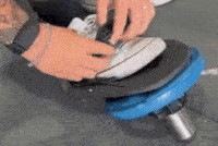 Exercise Physiologist Putting Tib Bar On Foot For Rehab